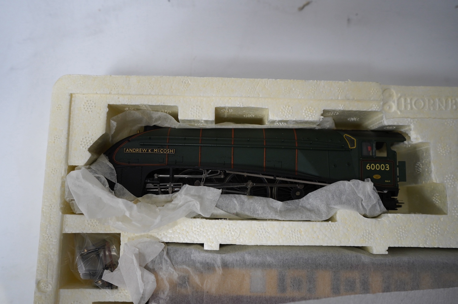 A Hornby Hobbies 00 gauge railway ‘the Northumbrian’ train pack, R2435, together with ‘the Northumbrian Coaches’ coach pack, R4228, comprising of a BR Class A4 locomotive and six maroon and cream coaches. Condition - goo